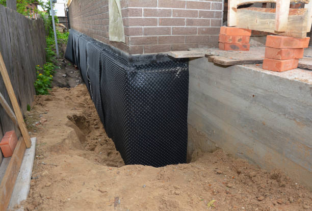 Happy homeowners after waterproofing job in Aberdeen